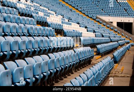 Empty Plastic Chairs In The Stands Of Football Stadium Stock Photo