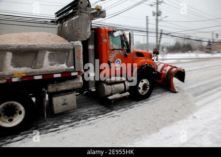 NORWALK, CT, USA-FEBRUARY 1, 2021:  Snow plow truck  during snow storm  day on Connecticut Ave. Stock Photo