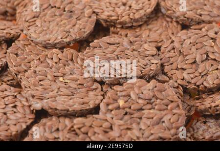 Close up of round organic flaxseed crackers Stock Photo