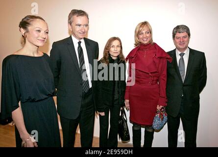 British photographer Vanessa Beecroft and LVMH CEO Bernard Arnault, French actress Isabelle Huppert, Helene Arnault, and Louis Vuitton CEO Yves Carcelles at the inauguration party of 'L'espace Louis Vuitton' where she exhibits her pictures, on the Champs Elysee Avenue, in Paris, France, on January 10, 2006. Photo by Laurent Zabulon/ABACAPRESS.COM Stock Photo