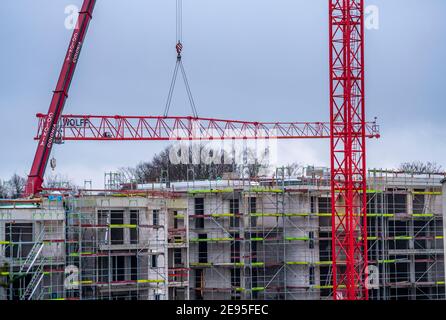 Dismantling of a large construction crane, on a large construction site, residential construction, shell is completed, Essen, NRW, Germany Stock Photo