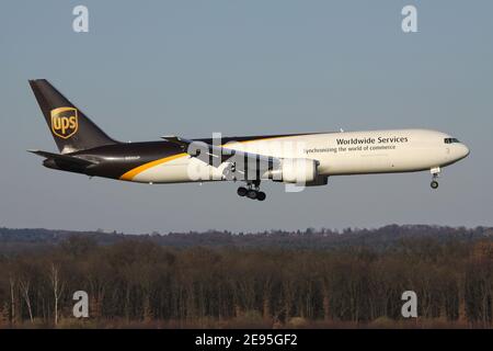 UPS Boeing 767-300F with registration N335UP on short final for runway 14L of Cologne Bonn Airport. Stock Photo