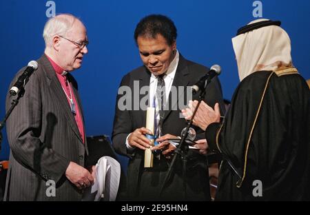 'Muhammad Ali (C), Former Heavyweight-Boxing Champion, Greatest of All Time (GOAT), USA is being presented with the crystal award by Lord Carey of Clifton (L), Former Archbishop of Canterbury, United Kingdom; Member of the Foundation Board of the World Economic Forum and H.R.H. Prince Turki Al Faisal, Chairman, King Faisal Center for Research and Islamic Studies, Saudi Arabia; Ambassador of Saudi Arabia to the USA at the 'Presentation of the Crystal Awards' at the Annual Meeting 2006 of the World Economic Forum in Davos, Switzerland, January 28, 2006. Photo by Peter Klaunzer/WEF/ABACAPRESS.COM Stock Photo