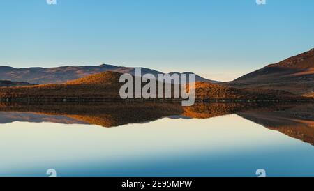 Loch Tarff with reflections at sunset Stock Photo