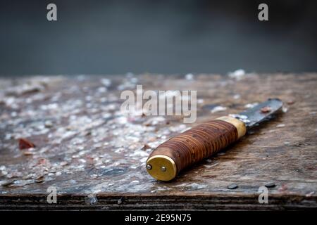 Same Knife On Cutting Board full of Fish Scales Stock Photo