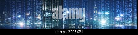 Matrix Mixed Media Background. Binary code virtual city skyline. Stock Photo