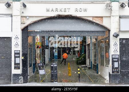 The entrance of Market Row during heavy snow, Brixton, London, 24 January 2021 Stock Photo