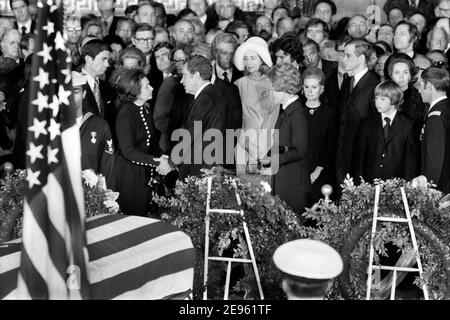 U.S. President speaking with Claudia 'Lady Bird' Johnson during former U.S. President Lyndon Johnson's Funeral inside Capitol Building, Washington, D.C., USA, Marion S. Trikosko, January 24, 1973 Stock Photo