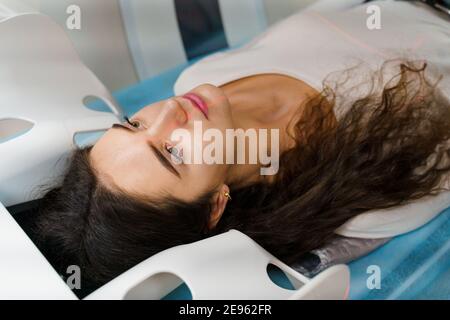 CT diagnosis of a girl with cancer. patient undergoes examination in the clinic using multispiral computed tomography Stock Photo