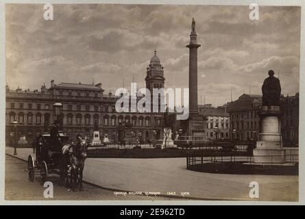 A horse-drawn carriage waits at George Square, Glasgow, Scotland, circa 1885. The Sir Walter Scott Monument is in the center and Merchants House to the left. Photography by G.W. Wilson & Co. Stock Photo