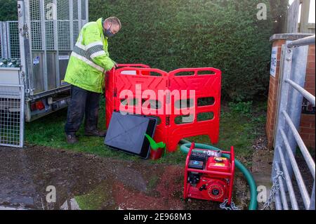 Cookham, Berkshire, UK. 2nd February, 2021. Flood water is pumped into Cookham Reach Sailing Club. A Flood Alert is in place in Cookham as the River Thames has burst it's banks. The Environment Agency were on hand today pumping out drains. Credit: Maureen McLean/Alamy Live News Stock Photo