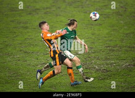 Lincoln City's Harry Anderson (right) and Hull City's Billy Chadwick battle for the ball during the Papa John's Trophy Quarter Final match at the KCOM Stadium, Hull. Picture date: Tuesday February 2, 2021. Stock Photo