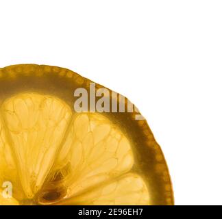 Detail quarter of a lemon slice backlit white isolated background. Square composition Stock Photo