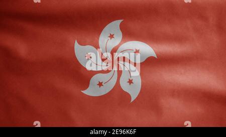 Hongkong flag waving in the wind. Close up of Hong Kong banner blowing, soft and smooth silk. Cloth fabric texture ensign background. Use it for natio Stock Photo