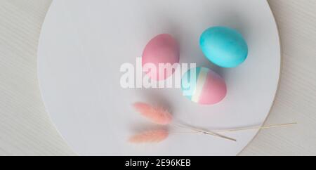 Delicate colors of Easter eggs on a white table Stock Photo