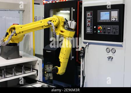 CNC machining center with automatic loading system. Selective focus. Stock Photo