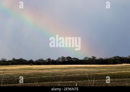 Nature Rainbow over pretty green Nebraska landscape. High quality photo Stock Photo