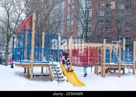 New York, United States. 02nd Feb, 2021. Kids and adults play in Battery Park covered with snow after major snowfall the day before brought more than foot on the ground in New York on February 2, 2021. (Photo by Lev Radin/Sipa USA) Credit: Sipa USA/Alamy Live News Stock Photo