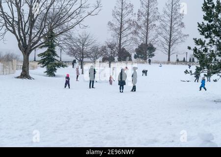 New York, United States. 02nd Feb, 2021. Kids and adults play in Battery Park covered with snow after major snowfall the day before brought more than foot on the ground in New York on February 2, 2021. (Photo by Lev Radin/Sipa USA) Credit: Sipa USA/Alamy Live News Stock Photo