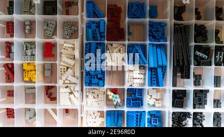 27 January 2021, Lower Saxony, Lüneburg: Lego bricks lie sorted in boxes. Because his parents wanted to get rid of the old Lego boxes, Benjamin Albrecht rediscovered his old passion. In the meantime, rebuilding Lüneburg has become a professional mainstay. Photo: Philipp Schulze/dpa Stock Photo