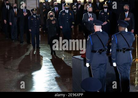 as the remains of Capitol Police officer Brian Sicknick arrive to lay in honor in the Rotunda of the US Capitol building after he died during the January 6th attack on Capitol Hill by a pro-Trump mob February 2, 2021, in Washington, DC.Credit: Brendan Smialowski/Pool via CNP/MediaPunch Stock Photo