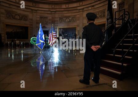 Washington, DC, USA. 2nd Feb, 2021. A U.S. Capitol Police Officer stands inside the Capitol Rotunda where fellow officer Brian D. Sicknick, 42, will lie in honor beginning on Tuesday evening, February 2, 2021. Officer Sicknick was responding to the riot at the U.S. Capitol on Wednesday, January 6, 2021, when he was fatally injured while physically engaging with the mob. Members of Congress will pay tribute to the officer on Wednesday morning before his burial at Arlington National Cemetery. Credit: Salwan Georges/Pool Via Cnp/Media Punch/Alamy Live News Stock Photo