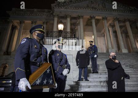 Washington, United States. 02nd Feb, 2021. U.S. Capitol Police wait with a flag for the family at the U.S. Capitol on February 02, 2021 in Washington, DC, USA. Sicknick died as a result of injuries sustained during the January 6 attack on the Capitol Building. Sicknic's remains will lie in honor through tomorrow, and then be buried at Arlington National Cemetery. Photo by Tasos Katopodis/Pool/ABACAPRESS.COM Credit: Abaca Press/Alamy Live News Stock Photo