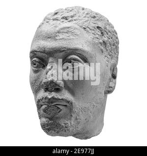 Antique head of the ancient man priest of Ancient Egyptian Isis with cracks sculpture. Face statue isolated on white background Stock Photo