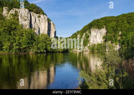 Danube river breakthrough near Kelheim, Bavaria, Germany with limestone rock formations and clear water on a sunny day Stock Photo