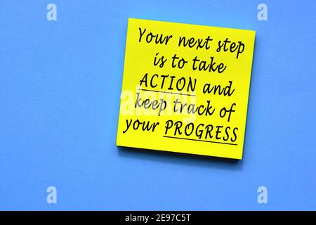 Text on yellow sticky note with blue background Stock Photo