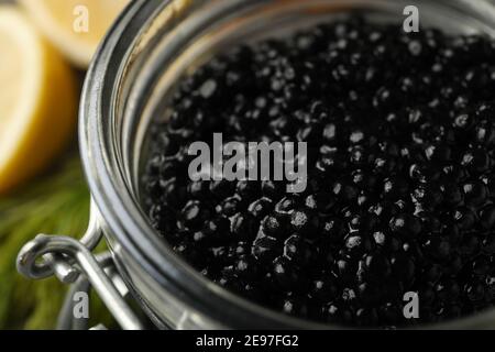 Glass jar with black caviar, close up Stock Photo