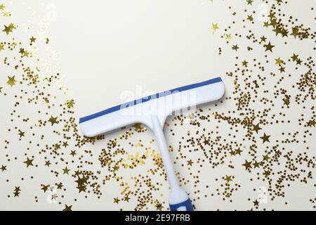 Window cleaning squeegee on white background with glitter Stock Photo