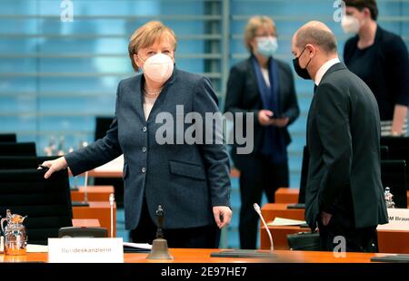 Berlin, Germany. 03rd Feb, 2021. German Chancellor Angela Merkel (CDU, l) arrives together with Olaf Scholz (SPD), Federal Minister of Finance, for the weekly cabinet meeting at the Chancellery. Credit: Michael Sohn/POOL AP/dpa/Alamy Live News Stock Photo