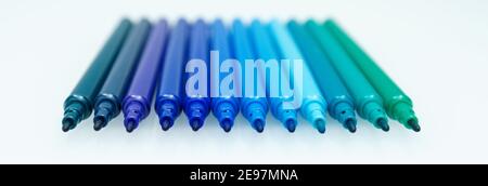 Banner with set of blue marker pens on white background. Selective focus. Different shades of blue Stock Photo