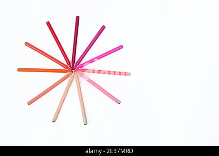 Circle of red colored markers on isolated background. Different shades of red. Design and creativity concept. Top view, space for text Stock Photo