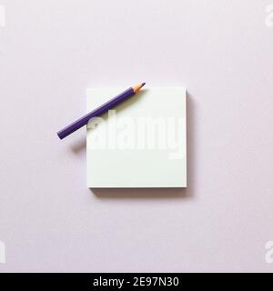 Memo paper, sticky notes with colored pencil on purple background. top view, copy space Stock Photo