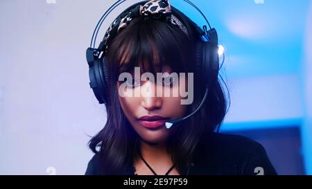 Portrait of young afican american black woman with headset working from home. High quality photo Stock Photo