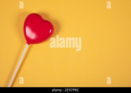 beautiful red hearts on yellow background, isolated, love concept Stock Photo