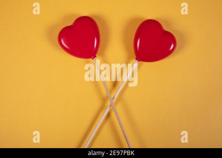 beautiful red hearts on yellow background, isolated, love concept Stock Photo
