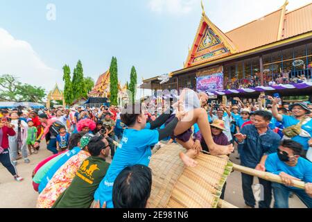 Chaiyaphum, Thailand - May 12, 2019: Parade of ancient pre-ordination of Buddhist which pre-monk on bamboo litter shaken severely before ordination in Stock Photo