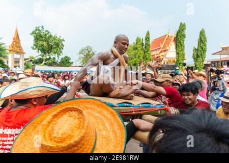 Chaiyaphum, Thailand - May 12, 2019: Parade of ancient pre-ordination of Buddhist which pre-monk on bamboo litter shaken severely before ordination in Stock Photo