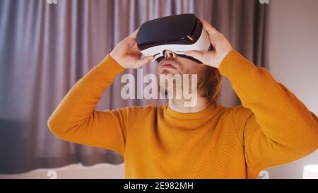 Young caucasian man using VR goggles. High quality photo Stock Photo