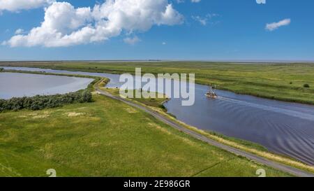 Drone aerial view, Shrimp boat in the Leyhoerner-Sieltief, Greetsiel, Lower Saxony, Germany, Europe Stock Photo