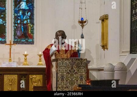 Brentwood Essex 3rd February 2021 Live streaming of a mass (holy communion) from St Thomas of Canterbury parish church Brentwood Essex, The Celebrant is Fr Oswald Trellis (Pictured) (Pictures taken with permission of the Clergy). Credit: Ian Davidson/Alamy Live News Stock Photo