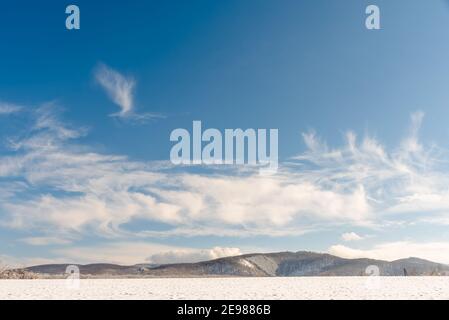 white fluffy clouds in the blue sky Stock Photo