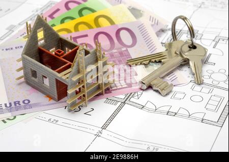 model home, Euro banknotes and keys laying on plan Stock Photo