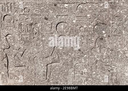 Alexandria, Egypt. Stone wall with weathered Egyptian hieroglyphs. Pompeys Pillar historical site Stock Photo
