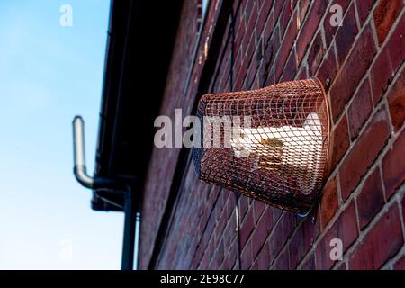 Boiler Flue Cage. attached to a house wall covering a boiler flue. UK Stock Photo