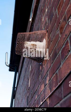 Boiler Flue Cage. attached to a house wall covering a boiler flue. UK Stock Photo