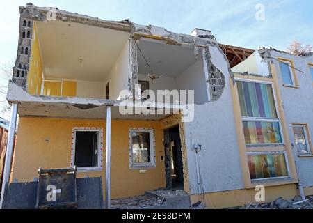 House demolition. A damaged house. A house is being demolished. A destroyed house Stock Photo